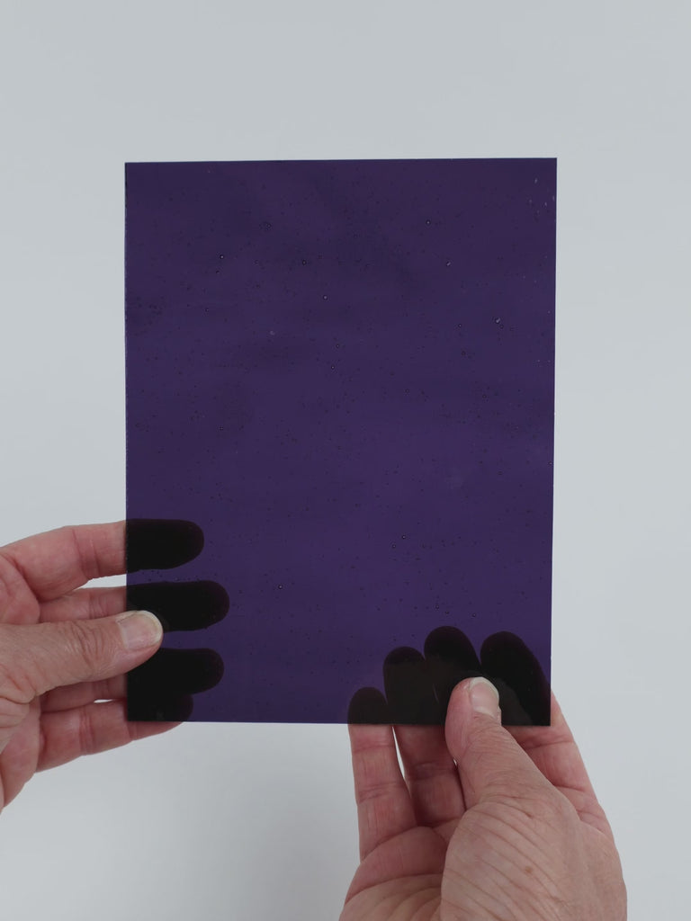 Video of the Deep Grape glass plate in transparent purple, 15x19cm, held up and tilted to show its pattern and transparency
