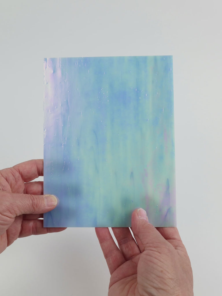 Video of the Heavens Blue glass plate in iridescent translucent blue, 15x19cm, held up and tilted to show its pattern and transparency