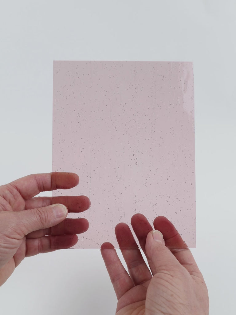 Video of the Pale Violet glass plate in transparent purple, 15x19cm, held up and tilted to show its pattern and transparency