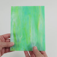 Video of the Sea Green Mottle glass plate in translucent teal, 15x19cm, held up and tilted to show its pattern and transparency