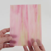 Video of the Dragon Fruit glass plate in translucent pink, 15x19cm, held up and tilted to show its pattern and transparency